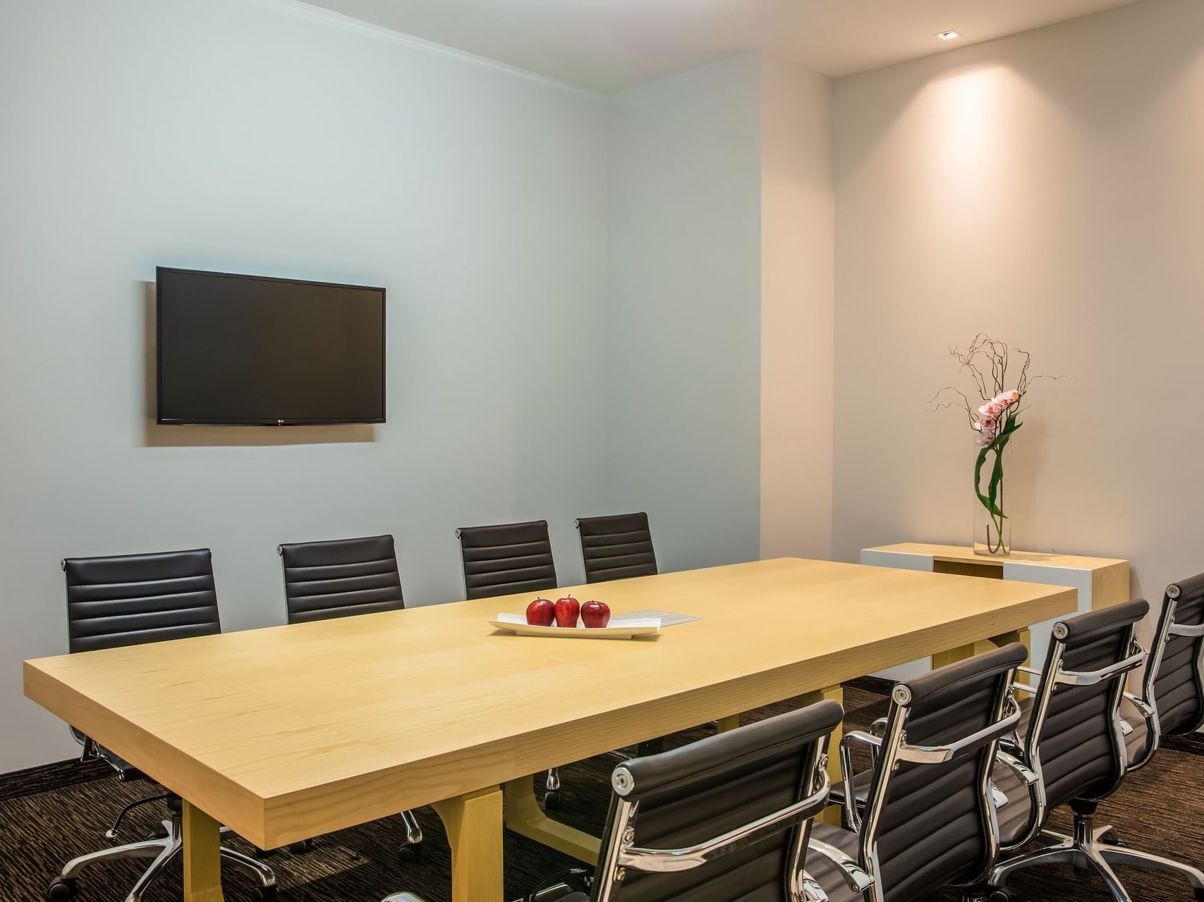 Conference table set up & Tv in a Business Centre at Fiesta Inn