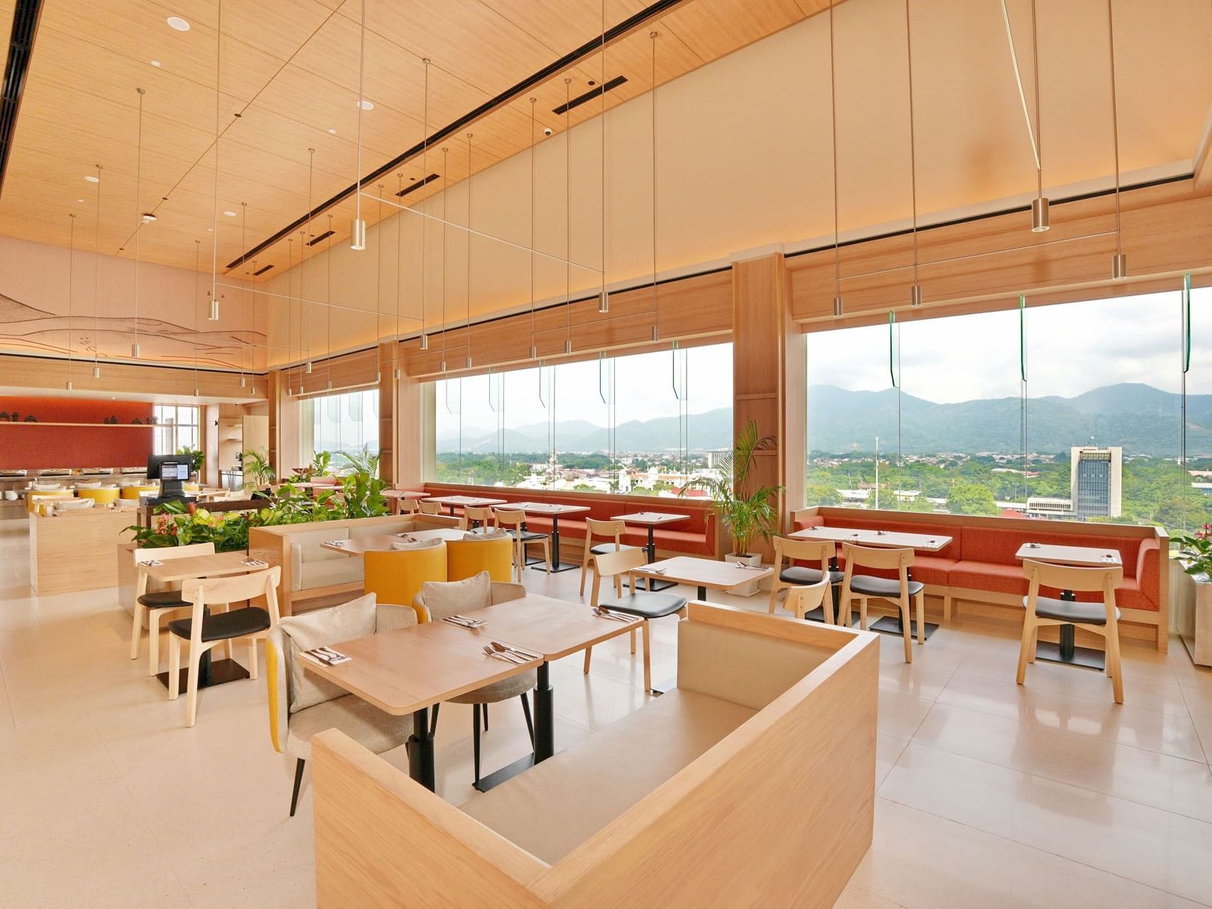 Dining area with large windows in Padang Terrace at Cititel Express Ipoh