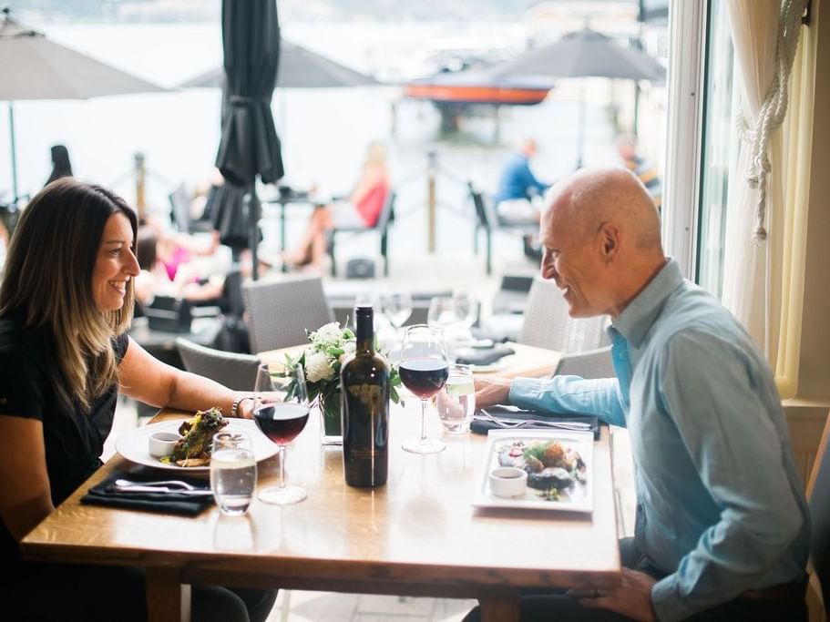 Couple enjoying meals with a lake view at Hotel Eldorado