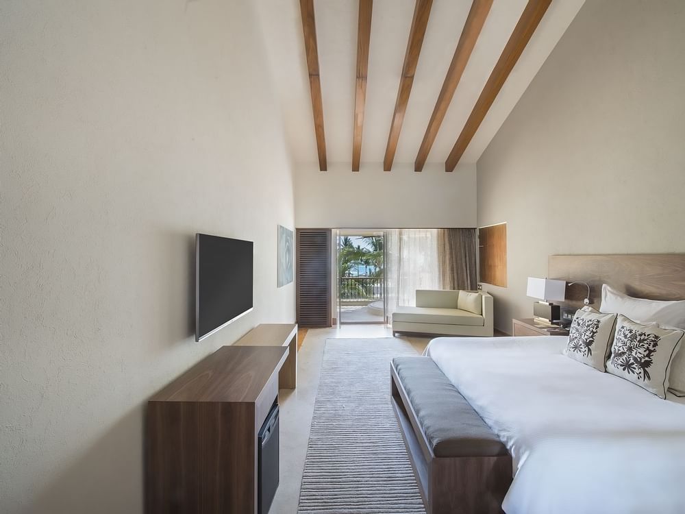 King bed with TV in front in Governor Suite at GFA Los Cabos