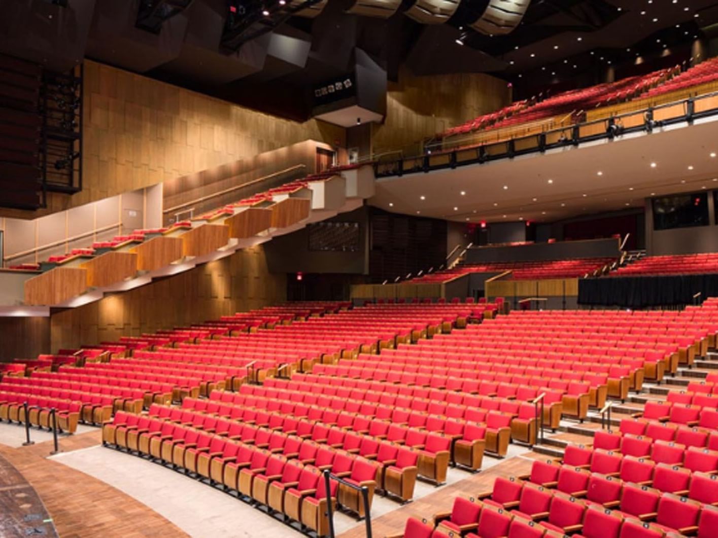 The Queen Elizabeth Theater with red seats and wooden balconies near Hotel X, a hotel in Toronto