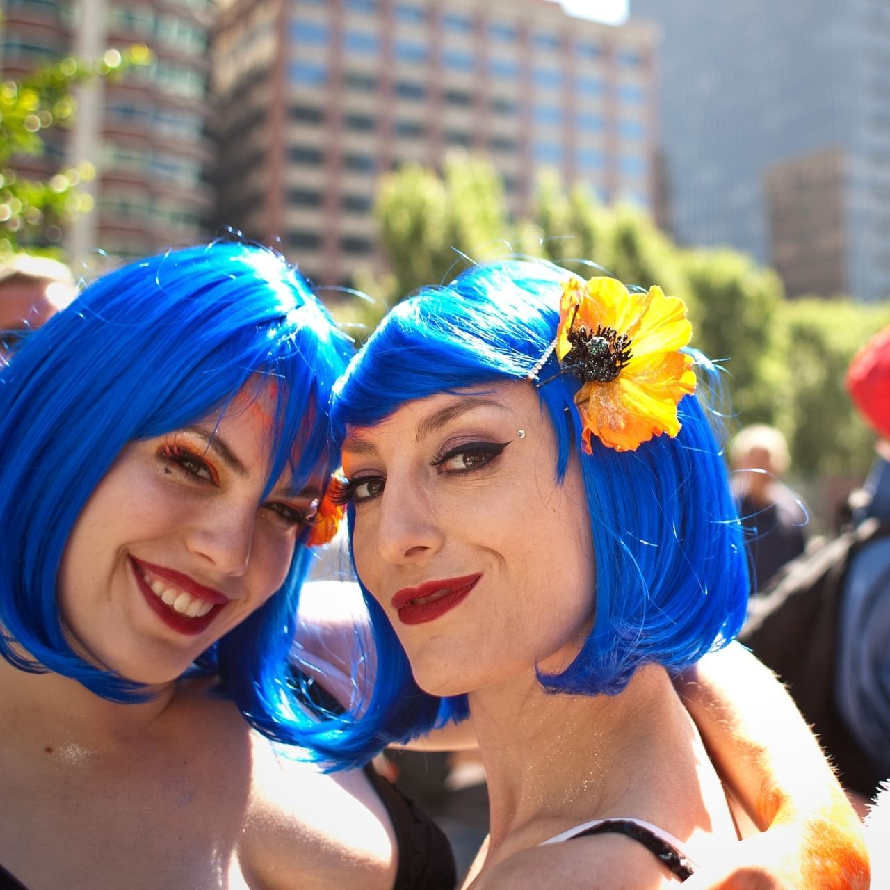 Close-up of two women posing with a smile in Folsom Street Fair near Becks Motor Lodge
