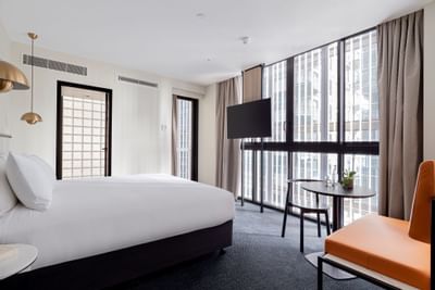 King bed & TV in Juliette room at Brady Hotels Jones Lane