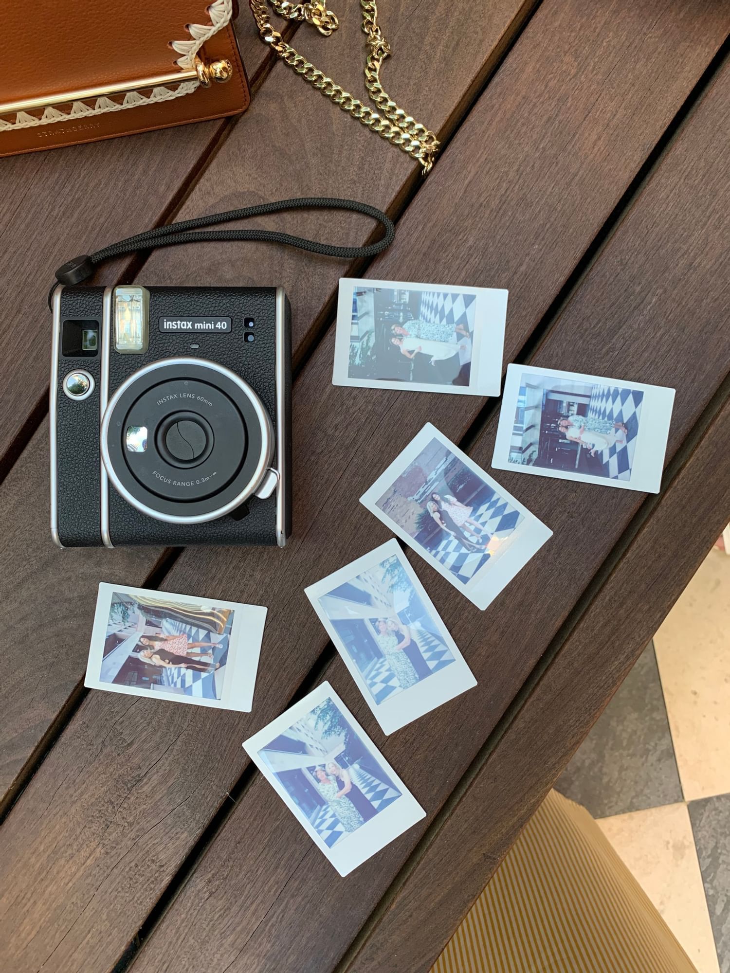 Old fashioned camera & photos on a table at ReStays Ottawa