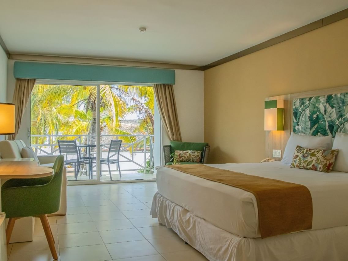 King bed in the Ocean View Room at Playa Blanca Beach Resort