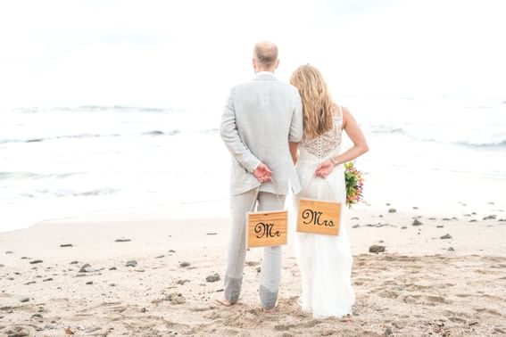 A wedded couple on the beach at Cala Luna Boutique Hotel