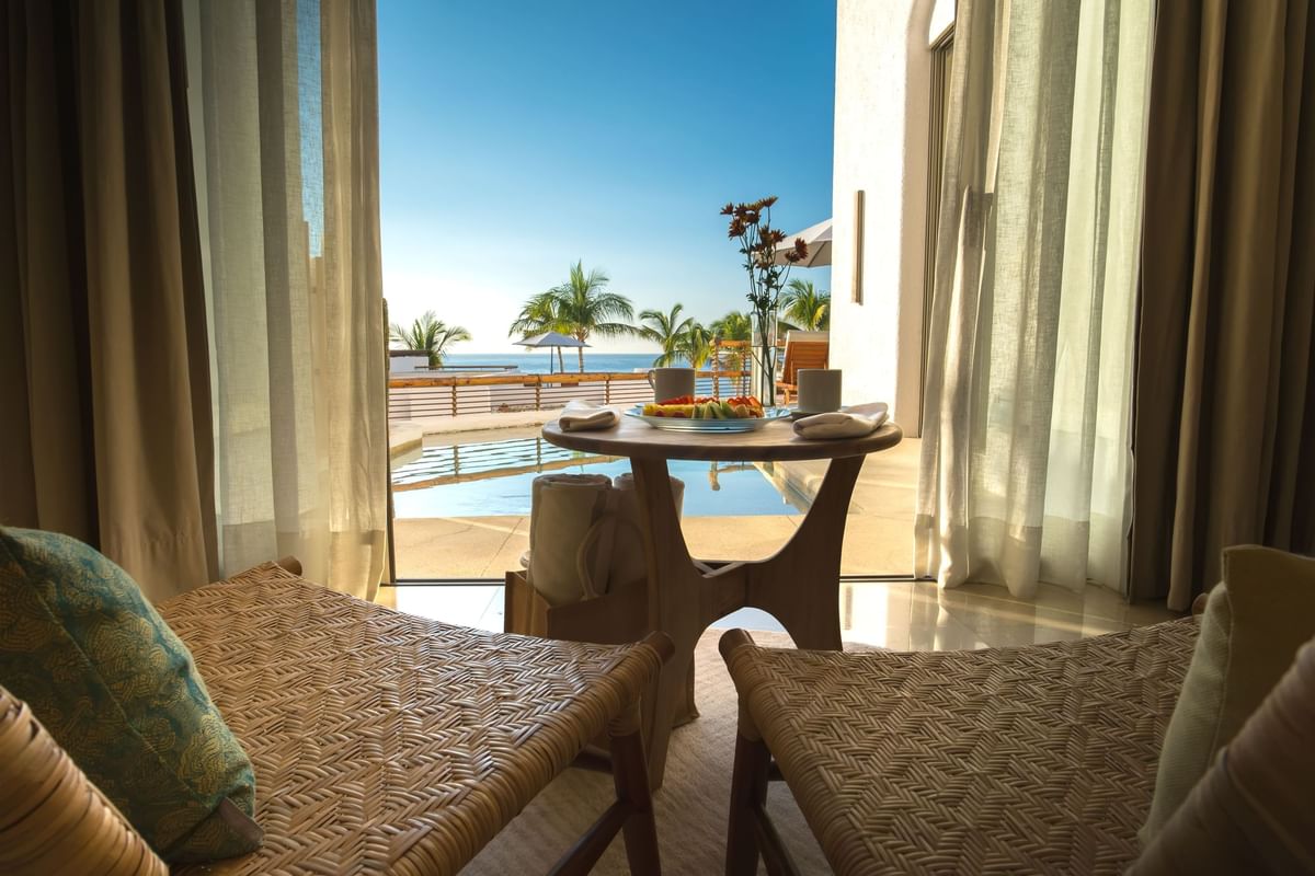 Ocean view from a suite with loungers and breakfast on a private patio at Marquis Los Cabos Resort