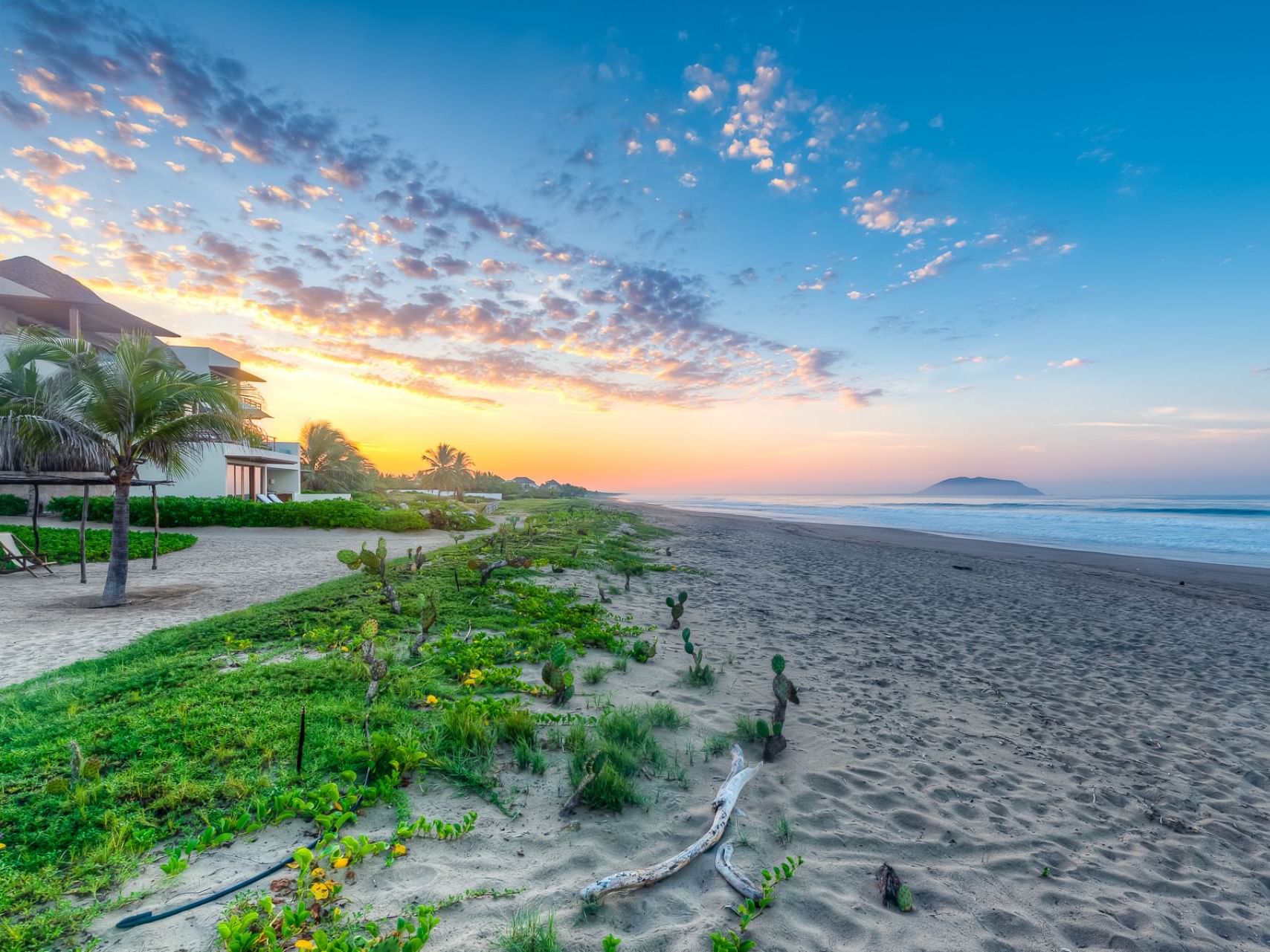 Landscape view of the beach at sunset, Marea Beachfront Villas