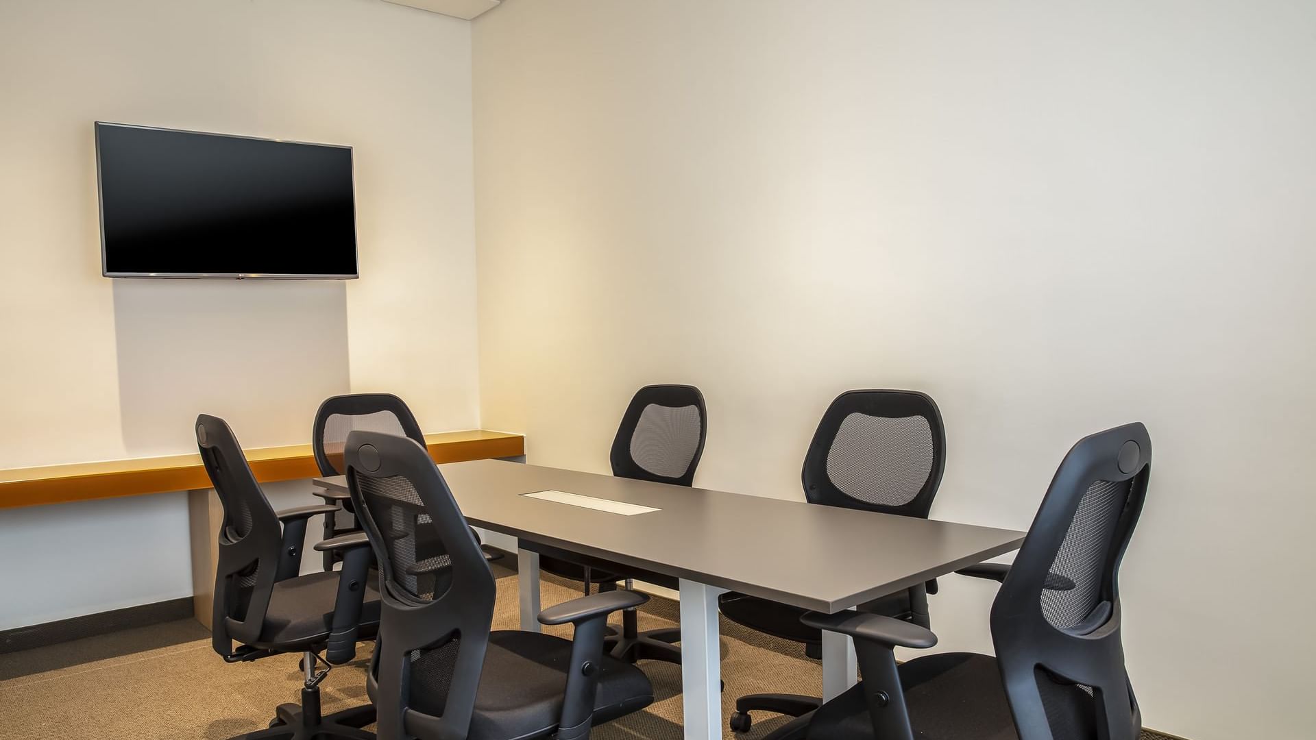 Table & a TV in Meeting Room at One Ciudad de México La Raza