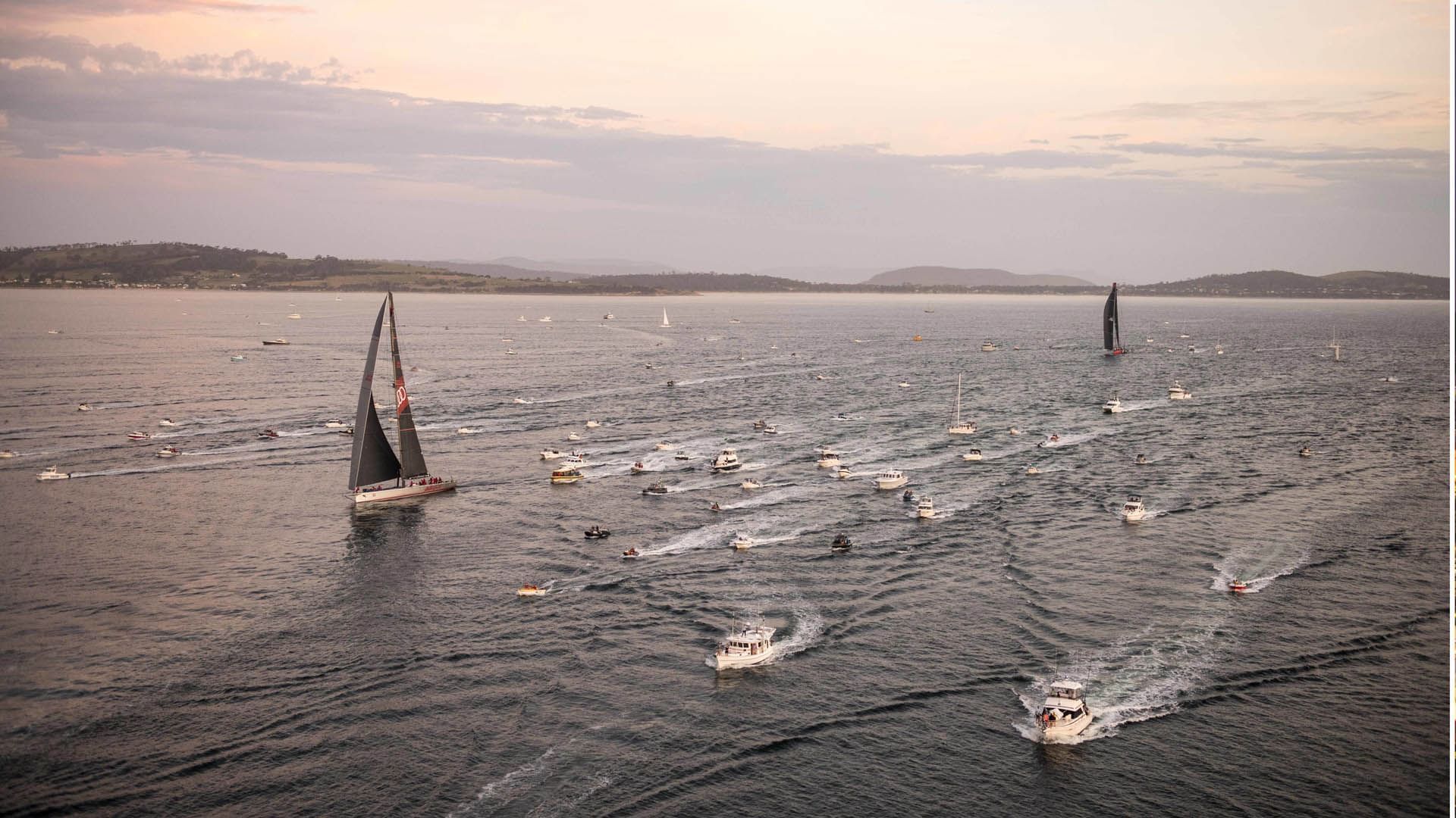 Aerial perspective of numerous yachts taking part in Hobart Yacht Race near Hotel Grand Chancellor Hobart