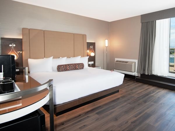 A cozy hotel room with king bed at Coast Victoria Hotel & Marina by APA