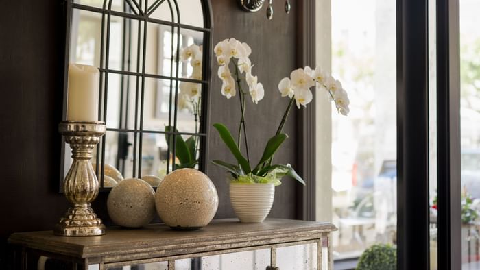 Three flower vases on the cupboard at Hotel napoleon