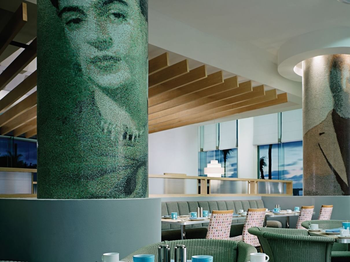 restaurant dining room with frida kahlo portrait on wall