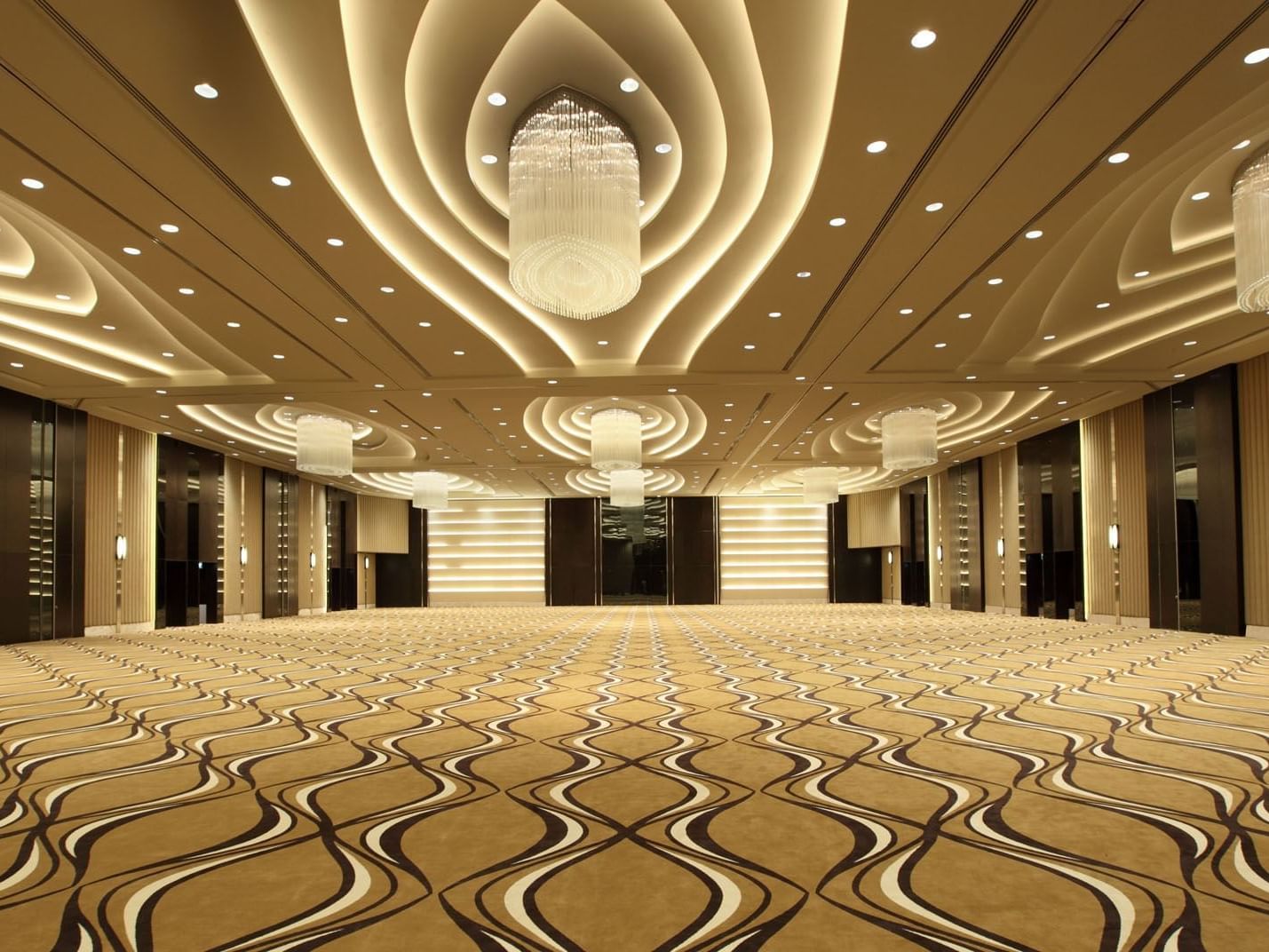 Grand Ballroom with chandeliers and carpeted floors at Po Hotel Semarang