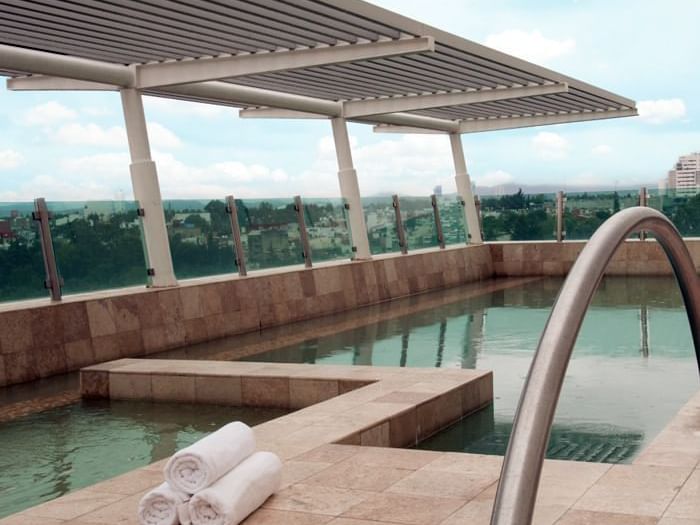 Outdoor swimming pool area at Fiesta Inn Hotels