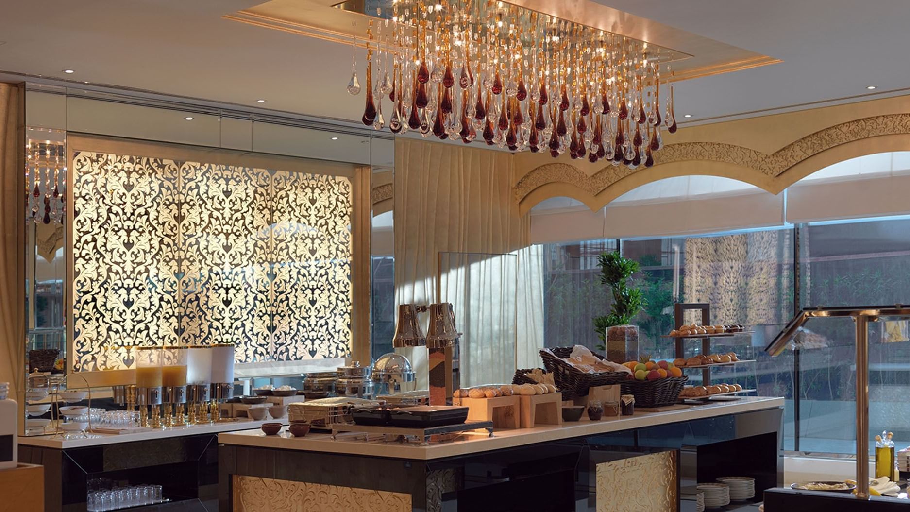 Buffet area with a variety of foods and drinks at DAMAC Maison Dubai Mall Street