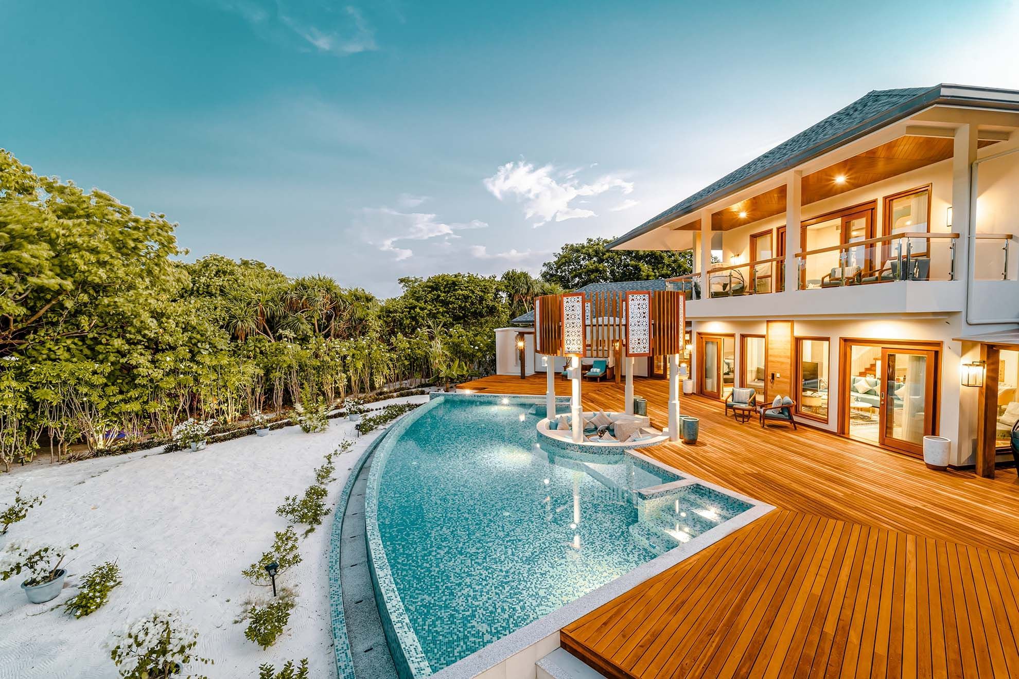 Wide angle shot of exterior of The Signature Collection & pool