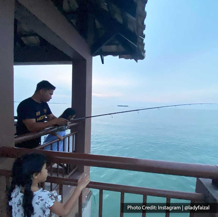 a father and his two kids are fishing at the water chalet - Lexis PD