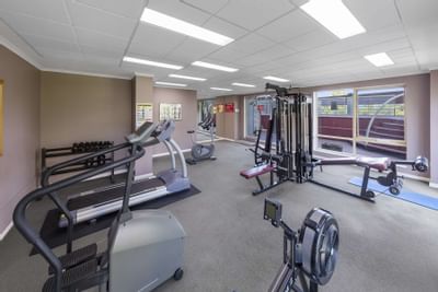 Interior of gymnasium with fitness machines at Nesuto Hotels