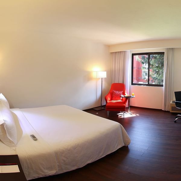 King bed & lounge in Executive Room with view at Fiesta Inn