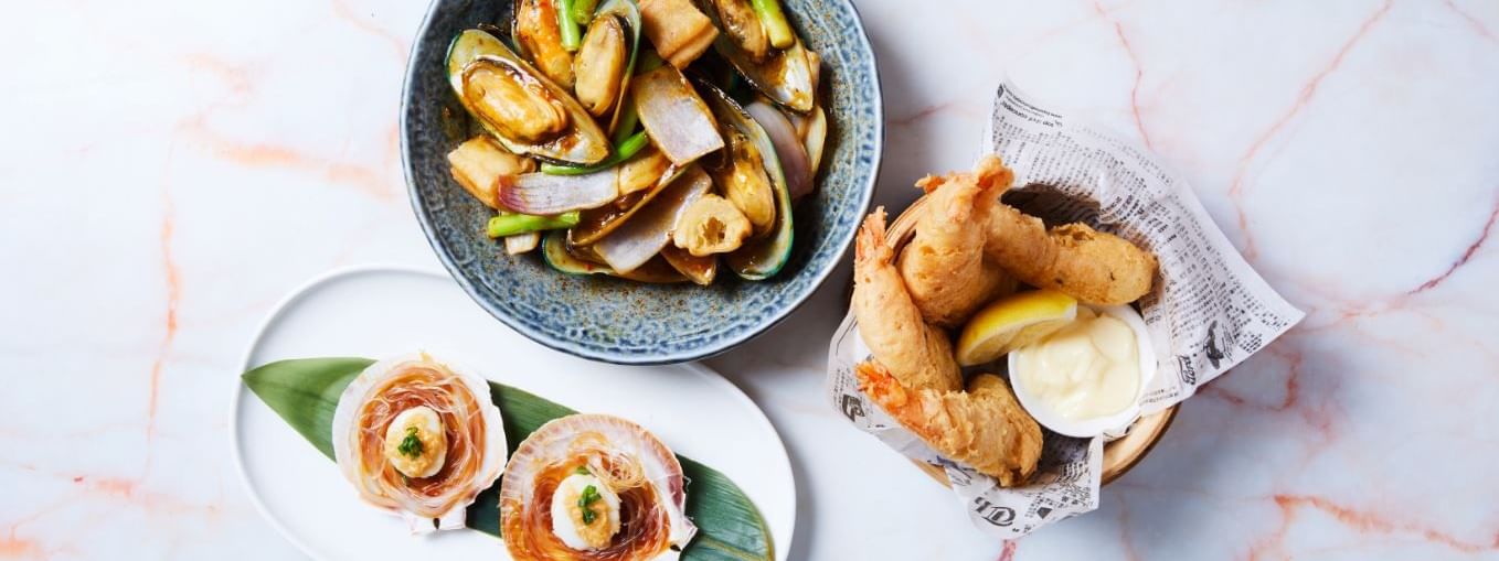 Beautiful seafood dishes like mussels, scallops, and fried prawns at CHU Restaurant by China Doll in Novotel Sydney