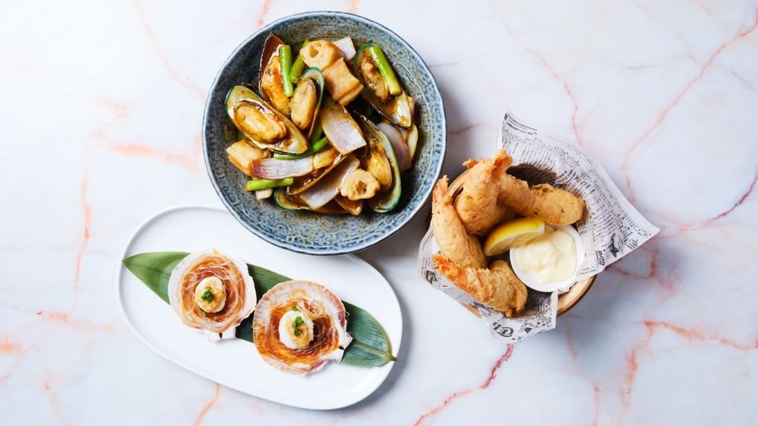 Beautiful seafood dishes like mussels, scallops, and fried prawns at CHU Restaurant by China Doll in Novotel Sydney
