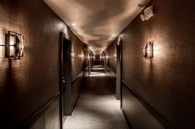 dim hallway with light on wall