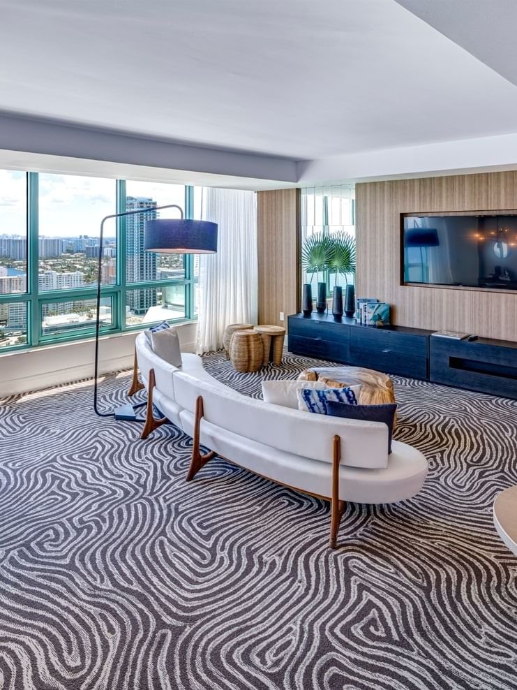 Presidential Suite living room with view of city and beach