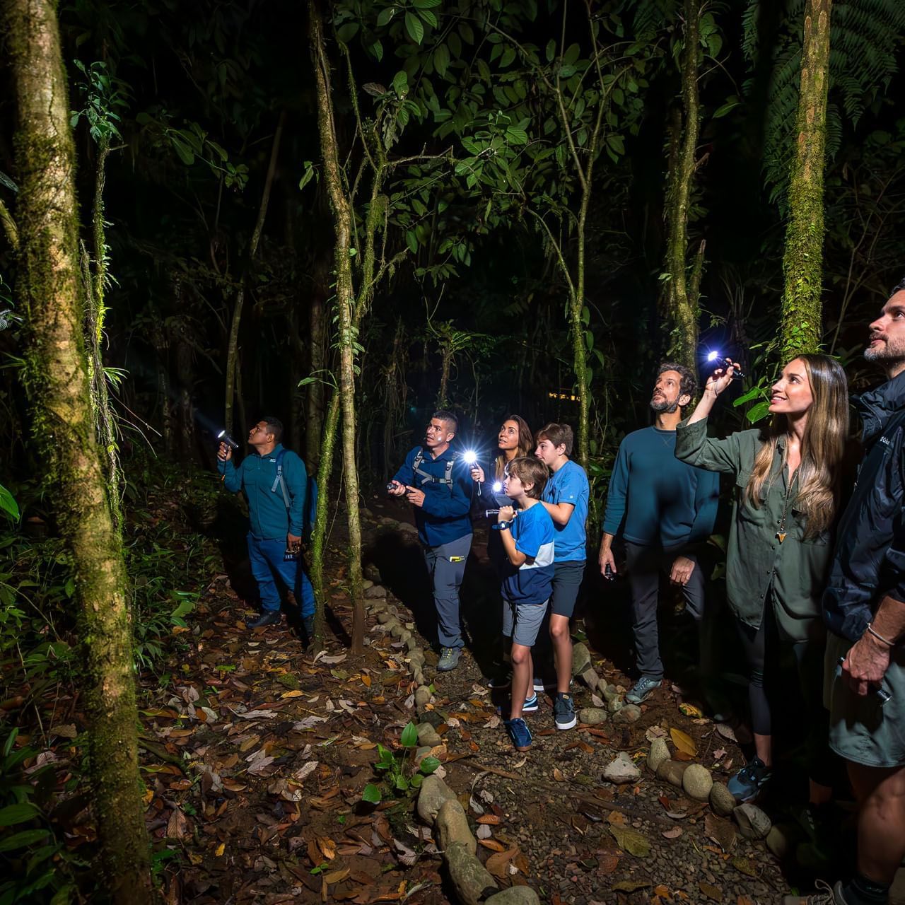 People on a night walk tour near Hideaway Rio Celeste