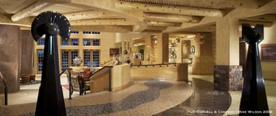 Grand lobby at Hilton Santa Fe Buffalo Thunder showcasing unique sculptures and Native American-inspired design