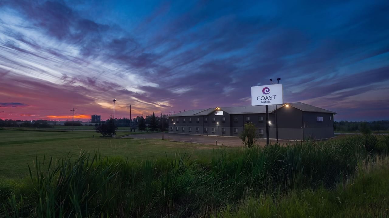 Coast Innisfail Hotel exterior at sunset