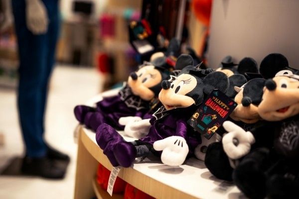 A collection of Halloween-themed Minnie Mouse plush toys.