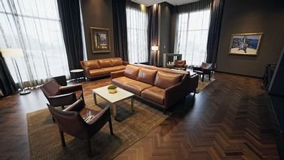 a couch and chairs in a lobby area