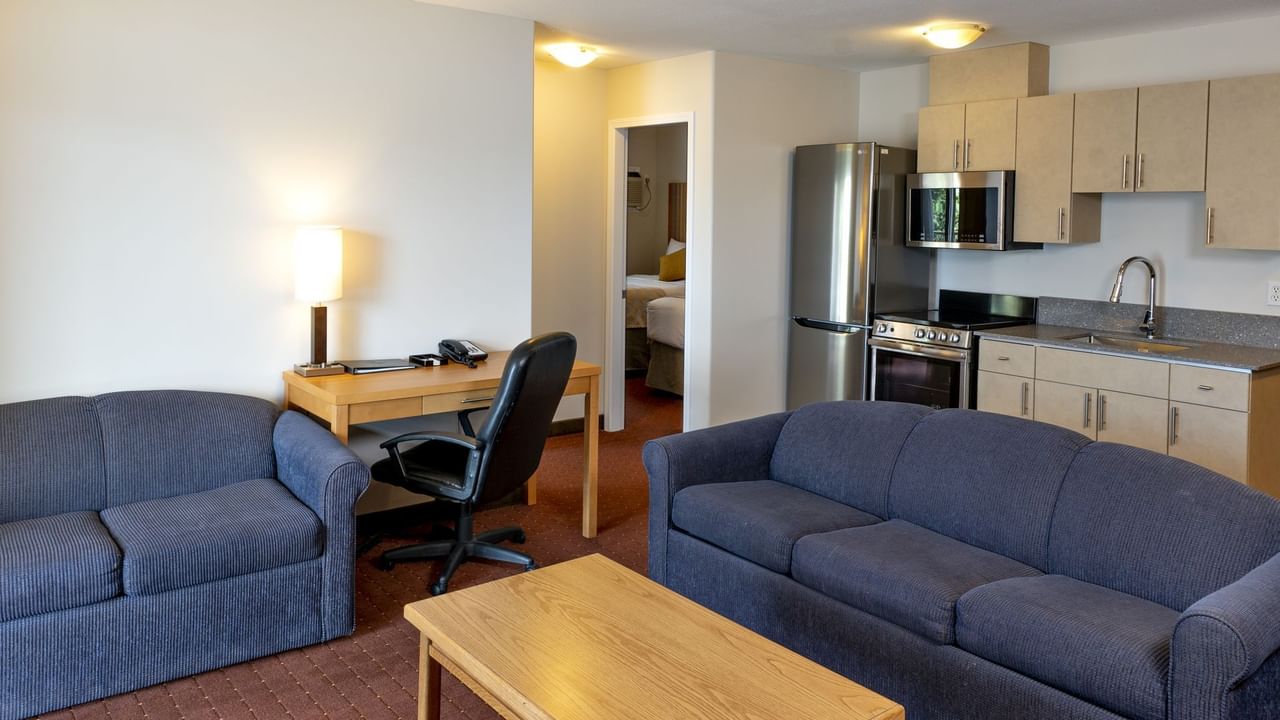 Sofas and table in living room of hotel suite