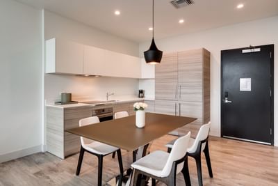 Dining table & kitchen in 2 Bedroom Suite at Costa Beach Resort