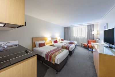 Triple beds in Deluxe Studio Apartments at Nesuto Hotels