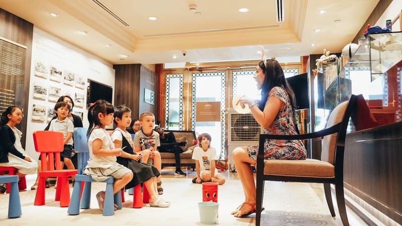 Close up of a lady narrating a story at Fullerton Singapore