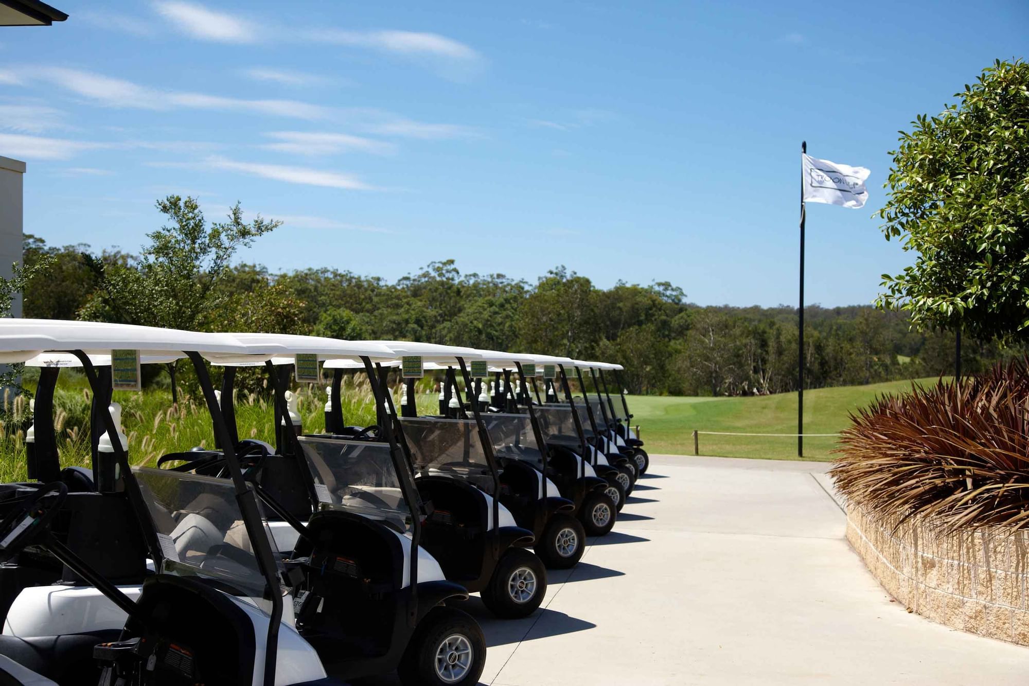 Golf carts parking in Kooindah Waters Golf Course on a sunny day near Mercure Kooindah Waters