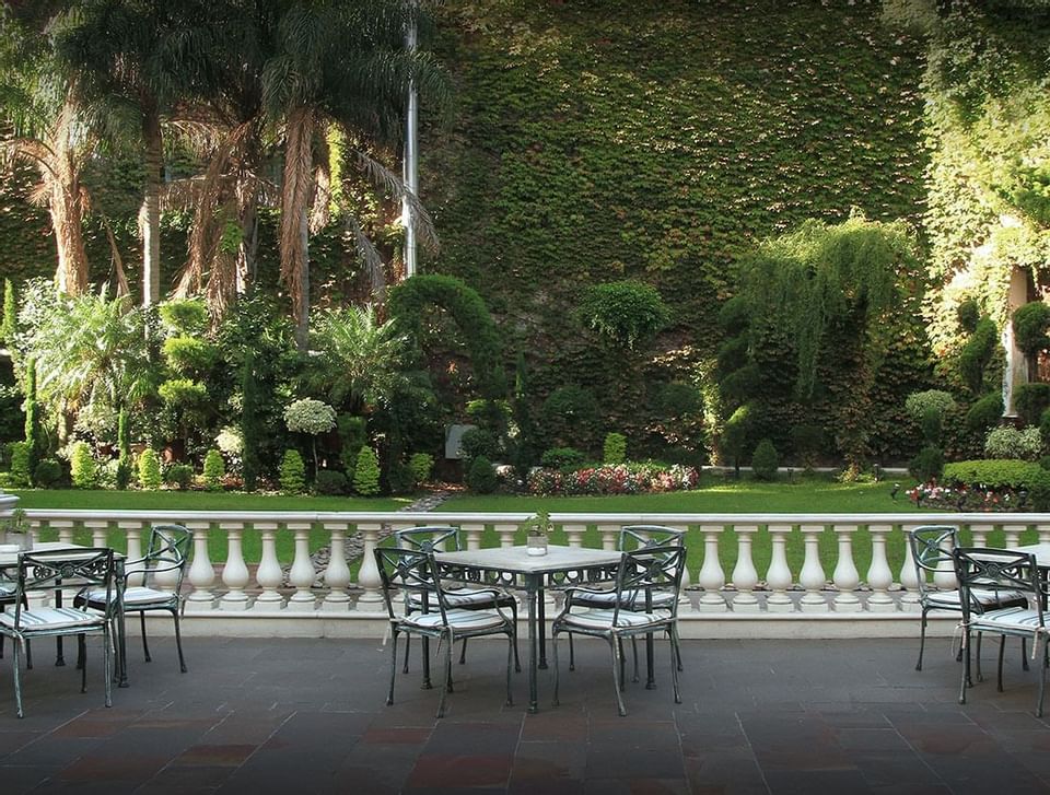 Patio tables in the garden at Hotel Emperador Buenos Aires