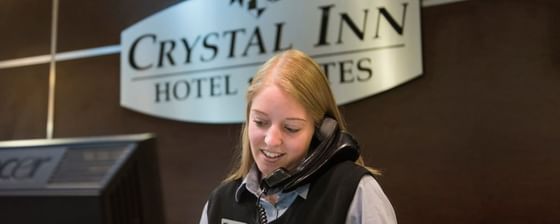 Receptionist is on the phone call in Lobby at Crystal Inn Salt Lake City