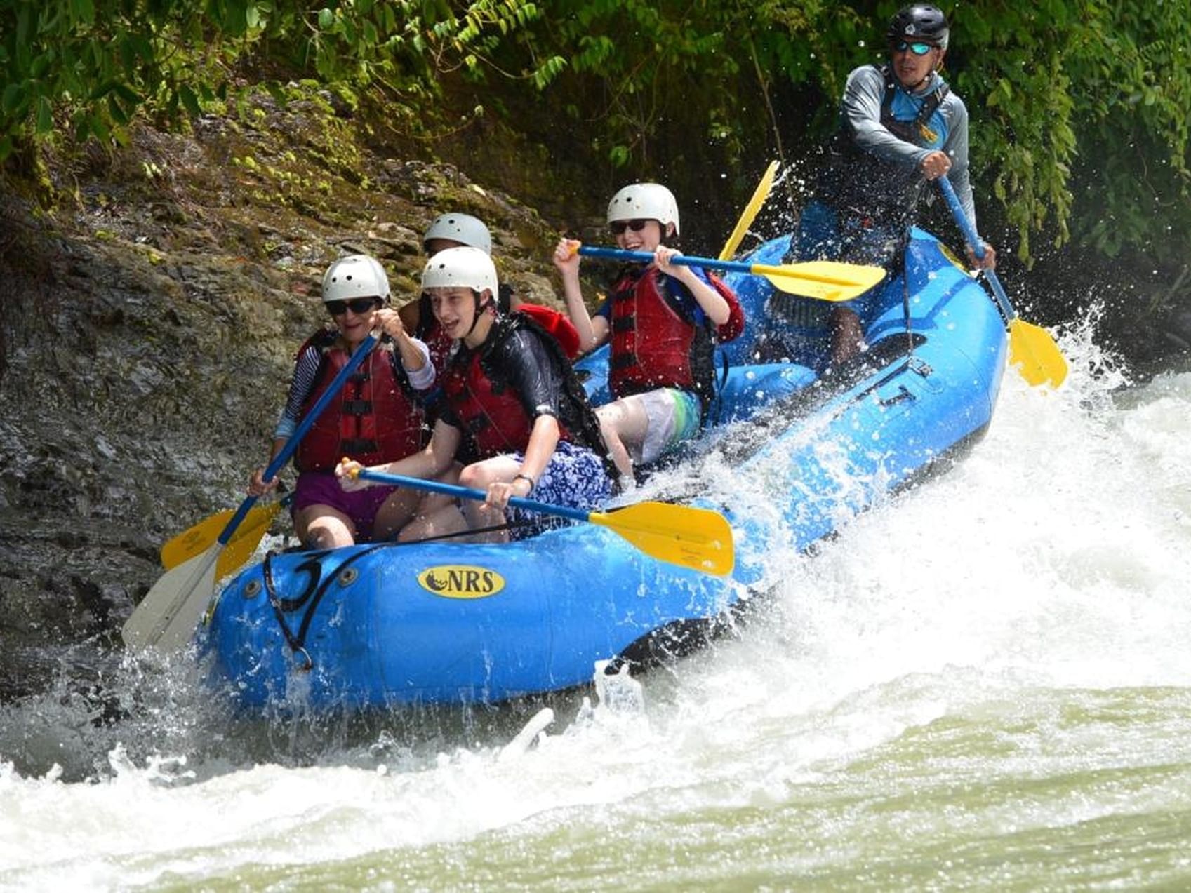 Group of people rafting near Jungle Vista Boutique Hotel