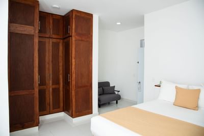 Interior view of Two-Bedroom Suite with a closet at Cha Cha Hotel