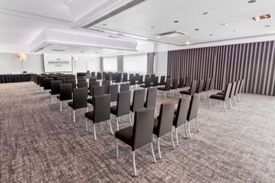 Rubislaw Theatre Style Room with chairs arranged neatly facing a projector screen at The Aberdeen Altens Hotel