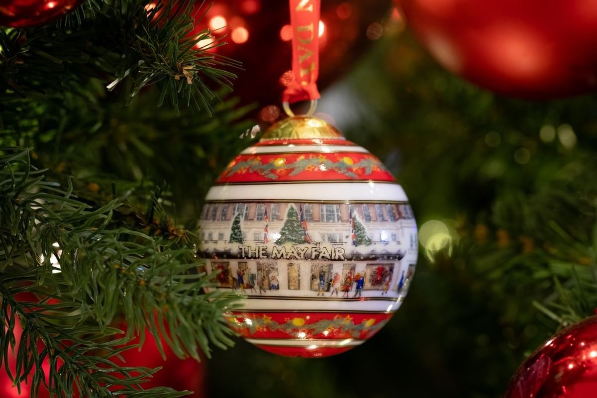 Close-up of Christmas tree ornament with festive design at The May Fair Hotel