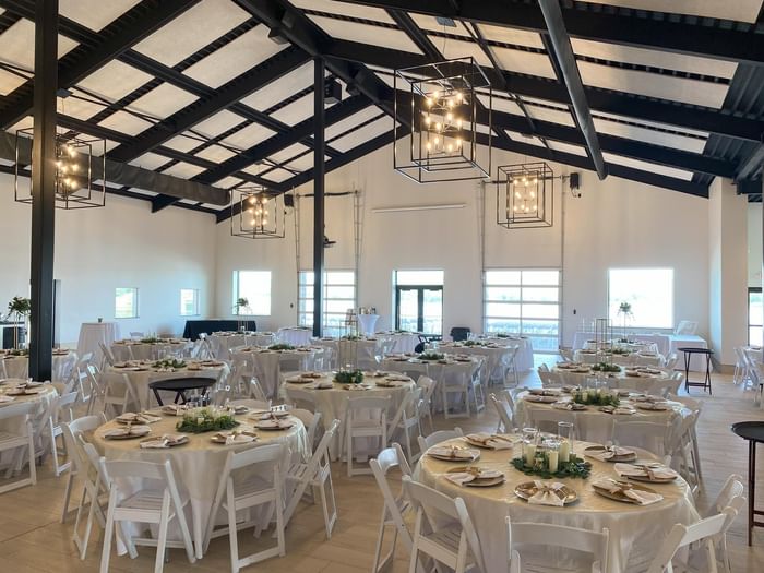 Event Center arranged with white seating at Off Shore Resort