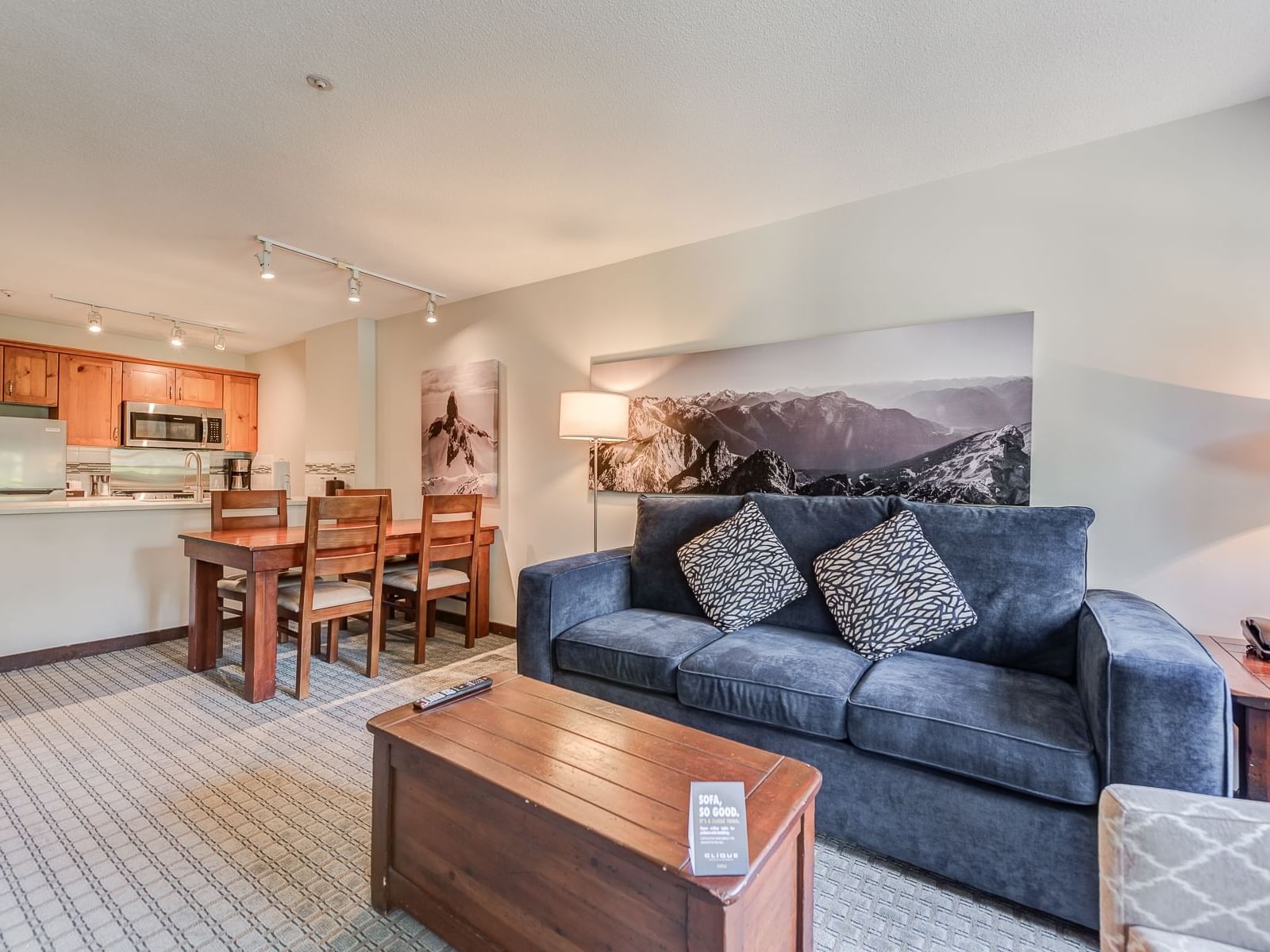 Dining table & kitchen by the living area in 1 Bedroom Suite at Blackcomb Springs Suites