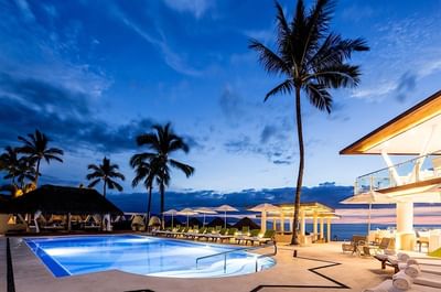 Scenic view of pool area at night by Villa Premiere Boutique Hotel & Romantic Getaway