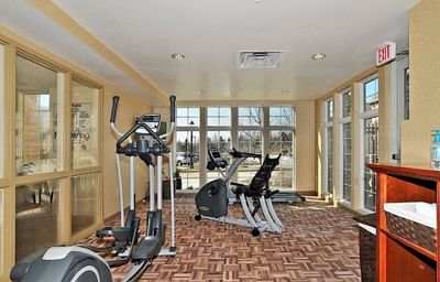 Interior of the Gym with fitness equipment by the window at The Wildwood Hotel