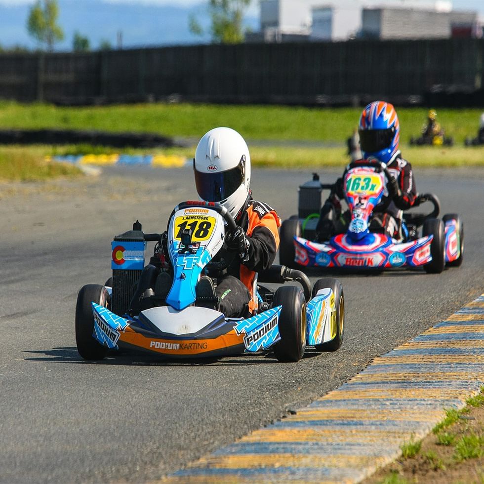 Two go-kart racers on a track near Falkensteiner Hotel Bratislava