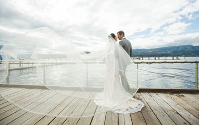 Bride and groom at the docks near Manteo Resort Waterfront